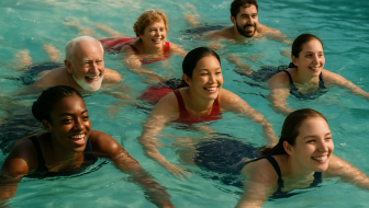 men and women swimming in the blue-green water with smiles on their faces